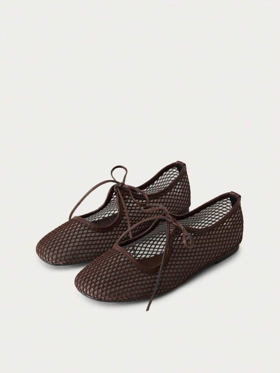 Nöista A Pair Of Fashionable Brown Flat Mesh Ballet Shoes, Featuring Breathable Mesh Design And Delicate Lace-Up Details, Creating A Modern Feminine Look. - Image 1